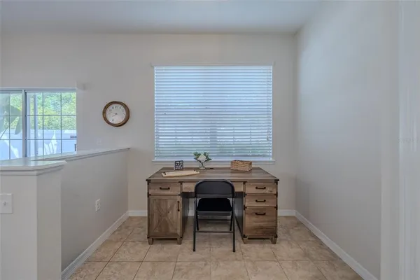 a view of a room that has a table and chairs in it