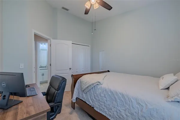 a bedroom with a bed and a chair