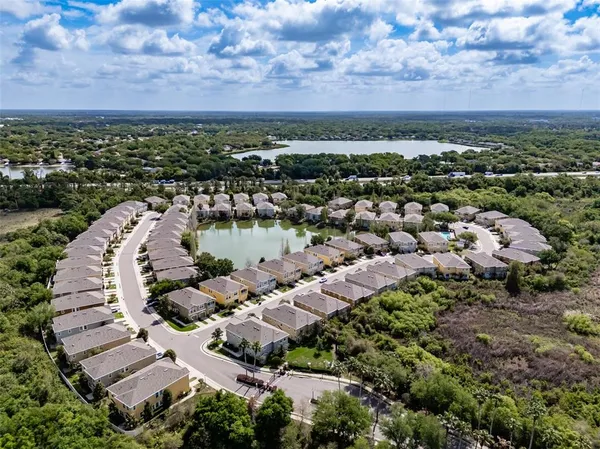 an aerial view of a house with a lake view