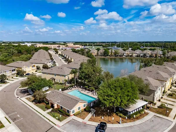 an aerial view of a house with a lake view