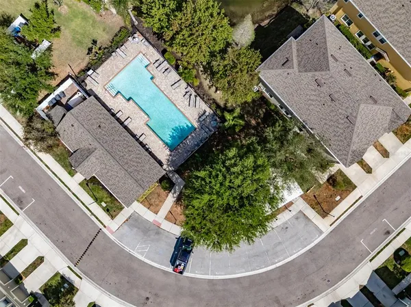 an aerial view of a house with a yard