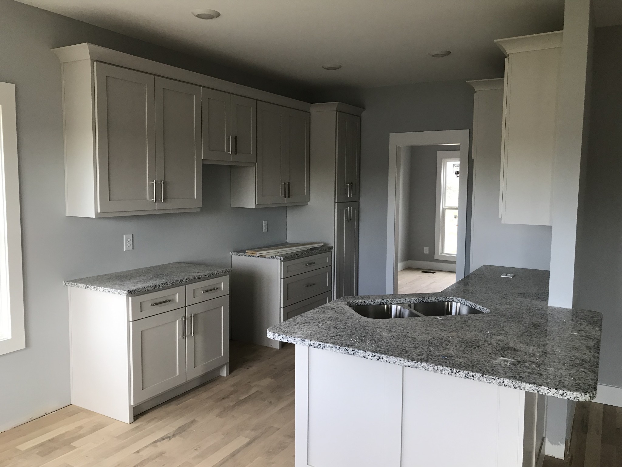 4875 Barren Plains Road Springfield, TN 37172 - Photo 5 of 6 a kitchen with granite countertop a sink a stove and a wooden floors