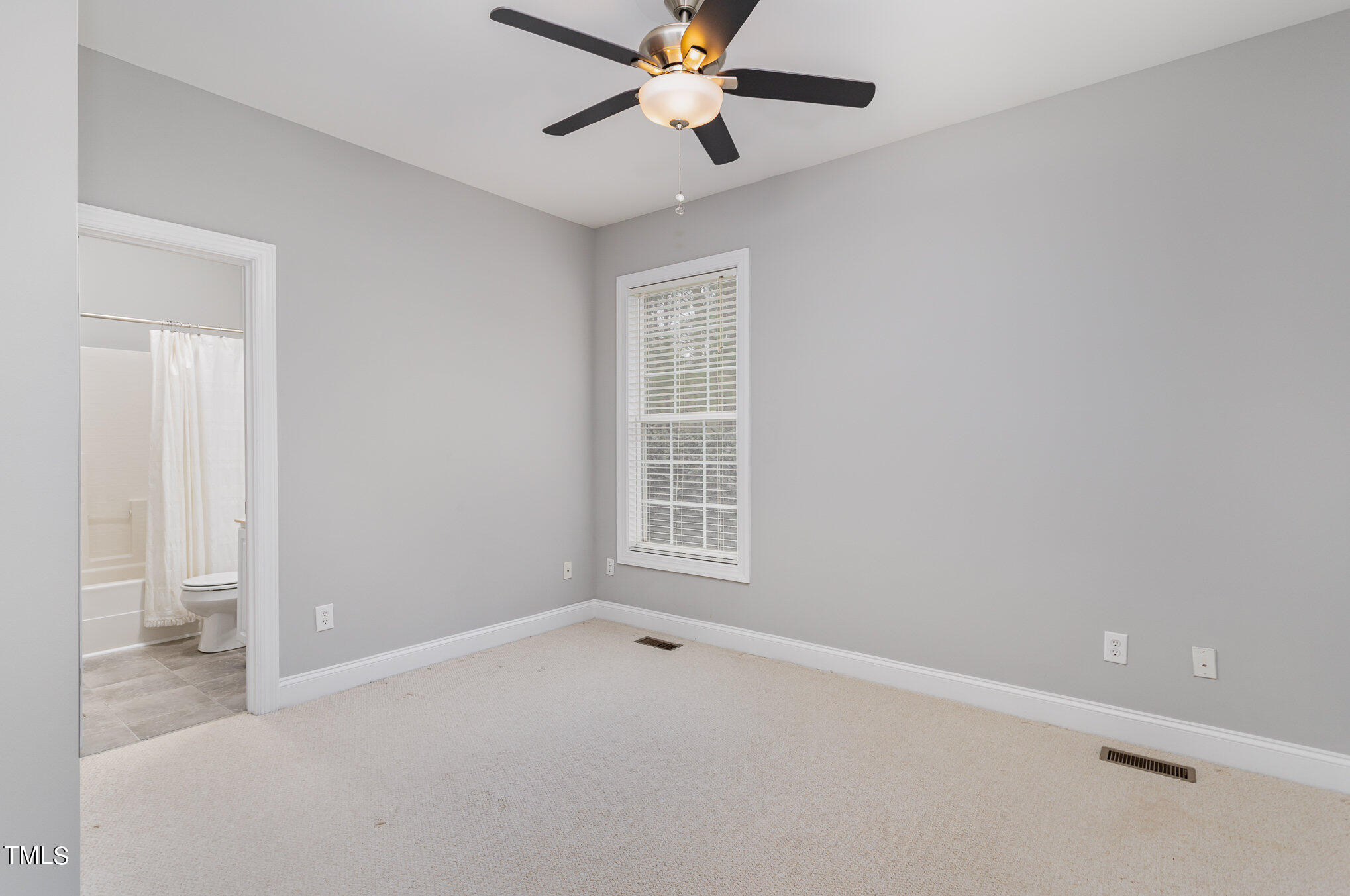 10201 Darling Street Raleigh, NC 27613 - Photo 11 of 23 a view of an empty room with a window