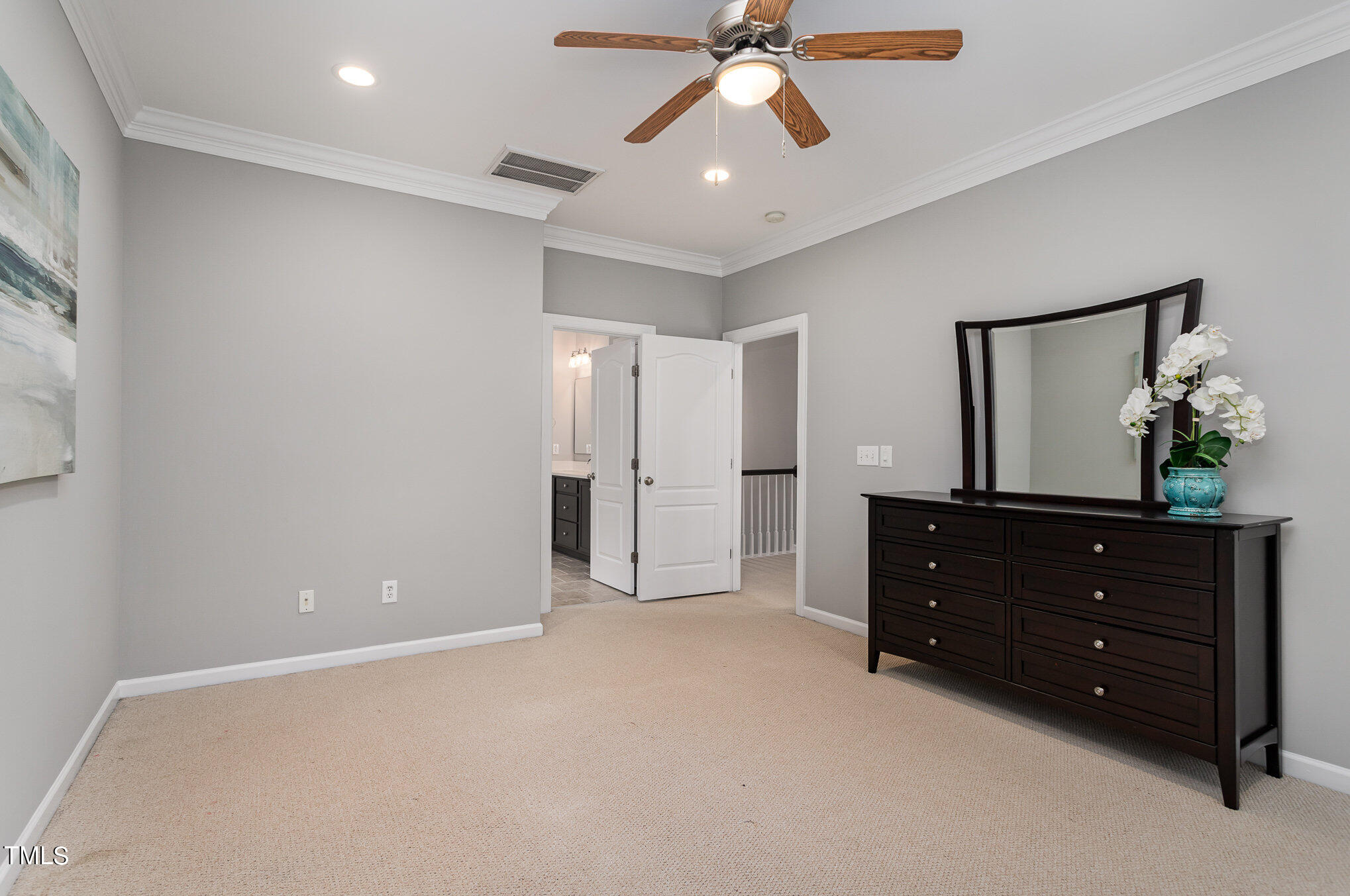 10201 Darling Street Raleigh, NC 27613 - Photo 14 of 23 a room with a dresser and a mirror