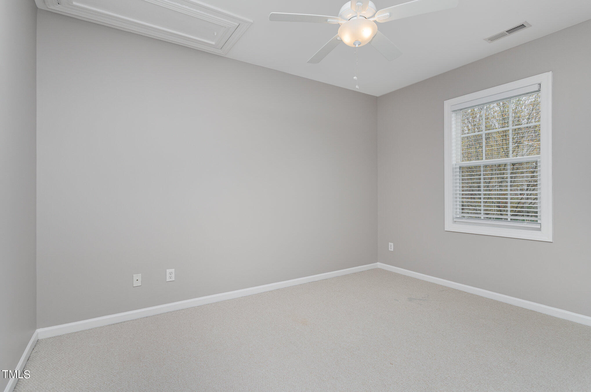 10201 Darling Street Raleigh, NC 27613 - Photo 18 of 23 an empty room with a window
