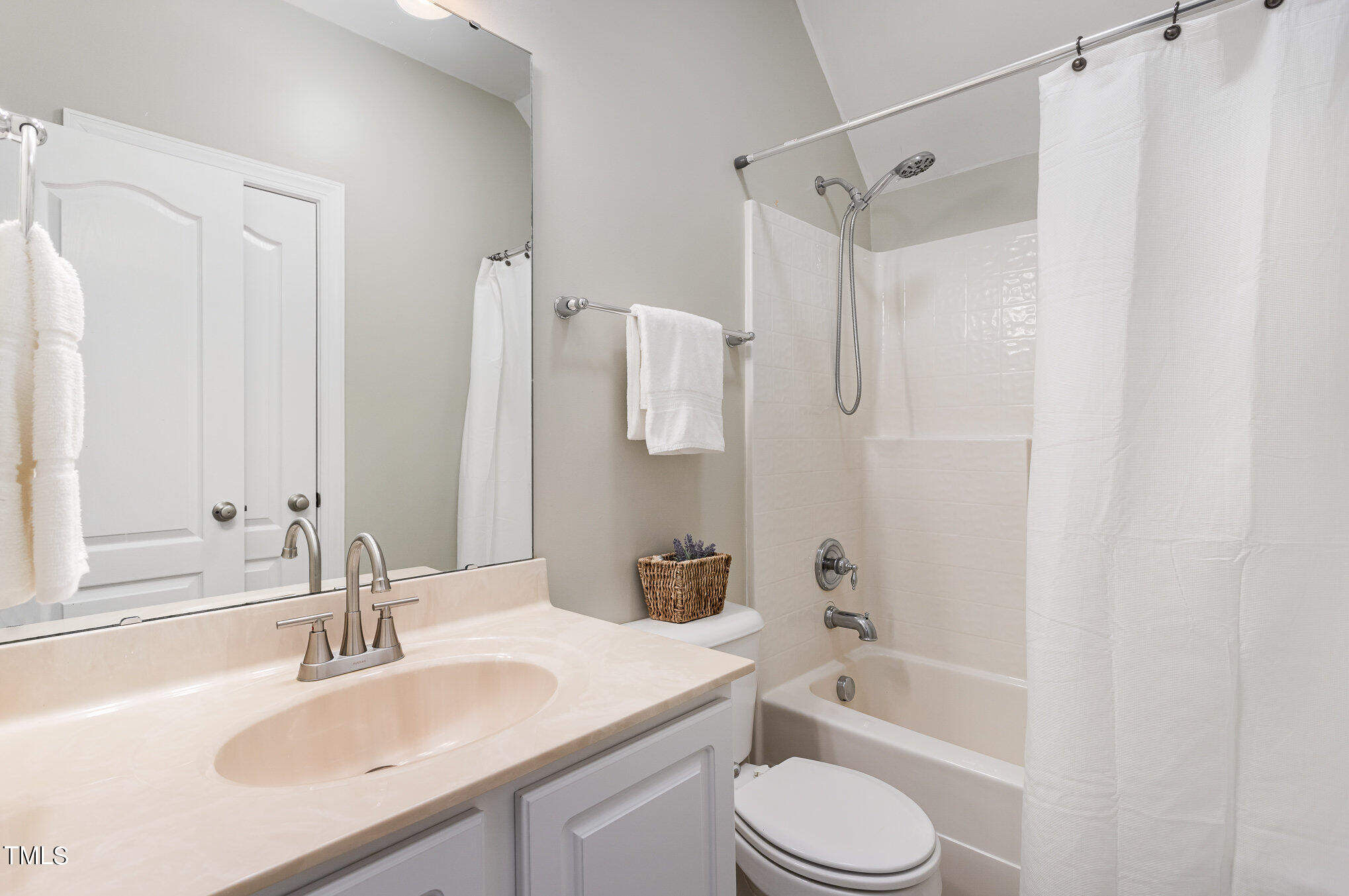 10201 Darling Street Raleigh, NC 27613 - Photo 19 of 23 a bathroom with a sink toilet tub and shower