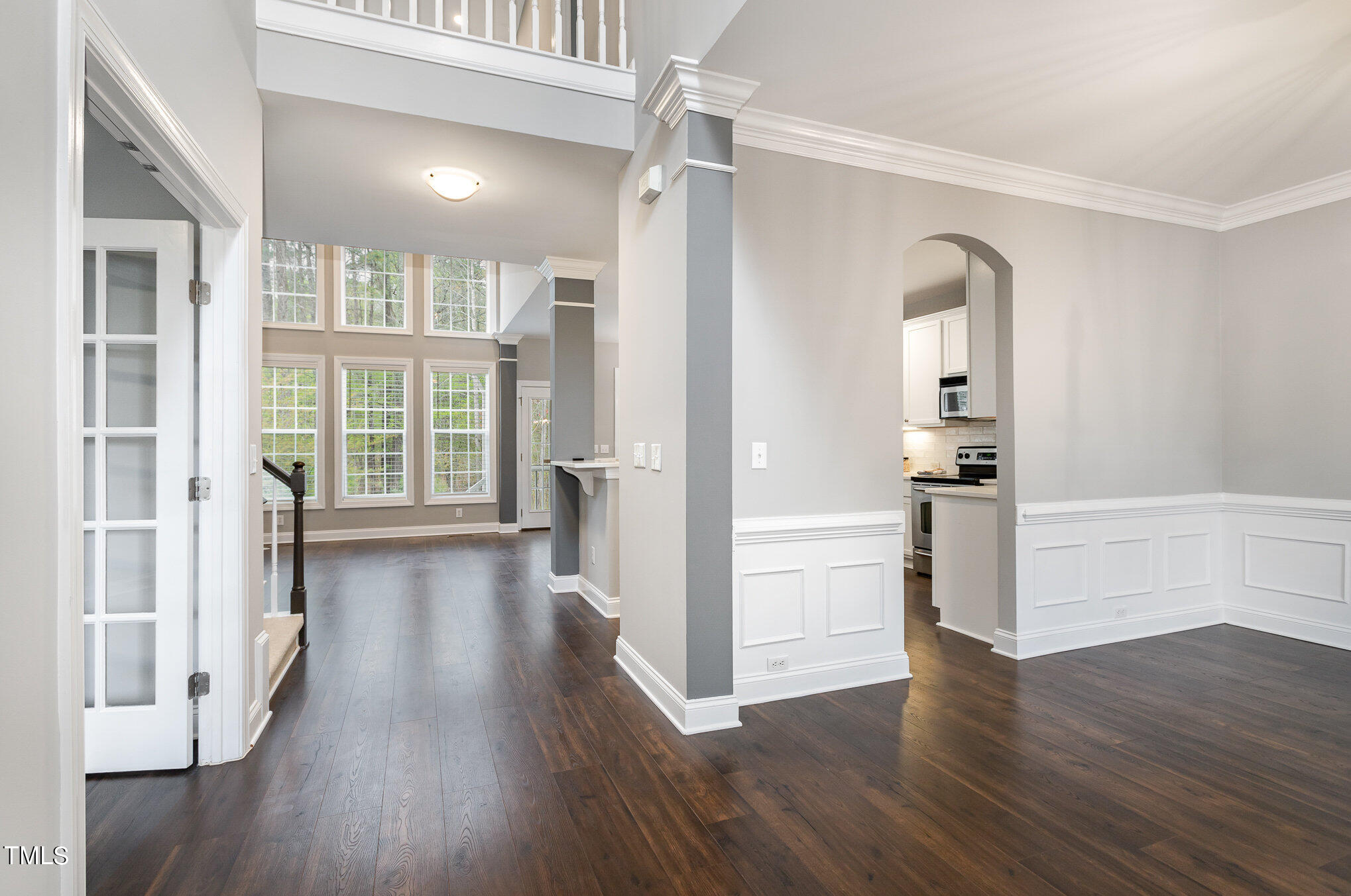10201 Darling Street Raleigh, NC 27613 - Photo 2 of 23 wooden floor in an empty room with a window