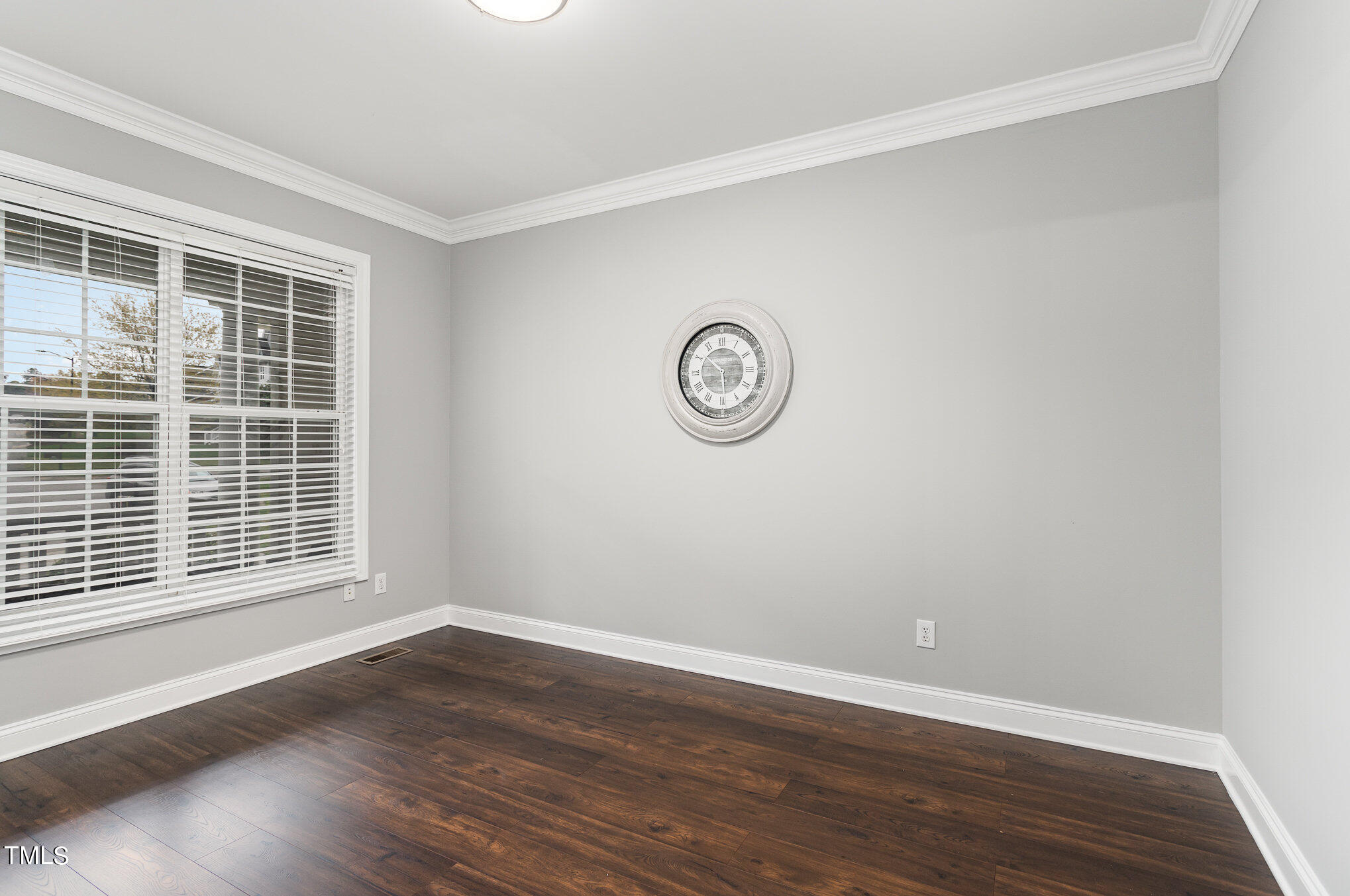 10201 Darling Street Raleigh, NC 27613 - Photo 5 of 23 a view of a room with wooden floor and windows