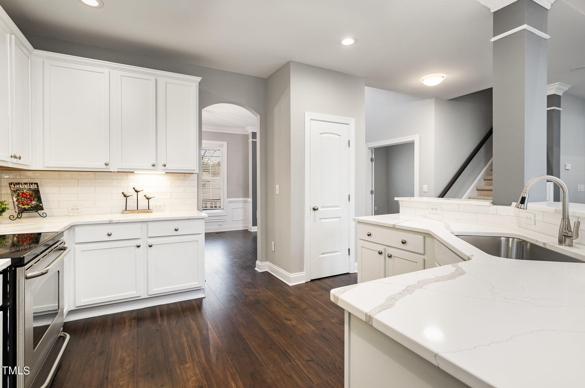 10201 Darling Street Raleigh, NC 27613 - Photo 7 of 23 a kitchen with lot of wooden cabinets and sink