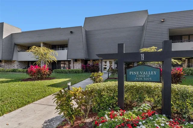 a view of a hallway with seating area