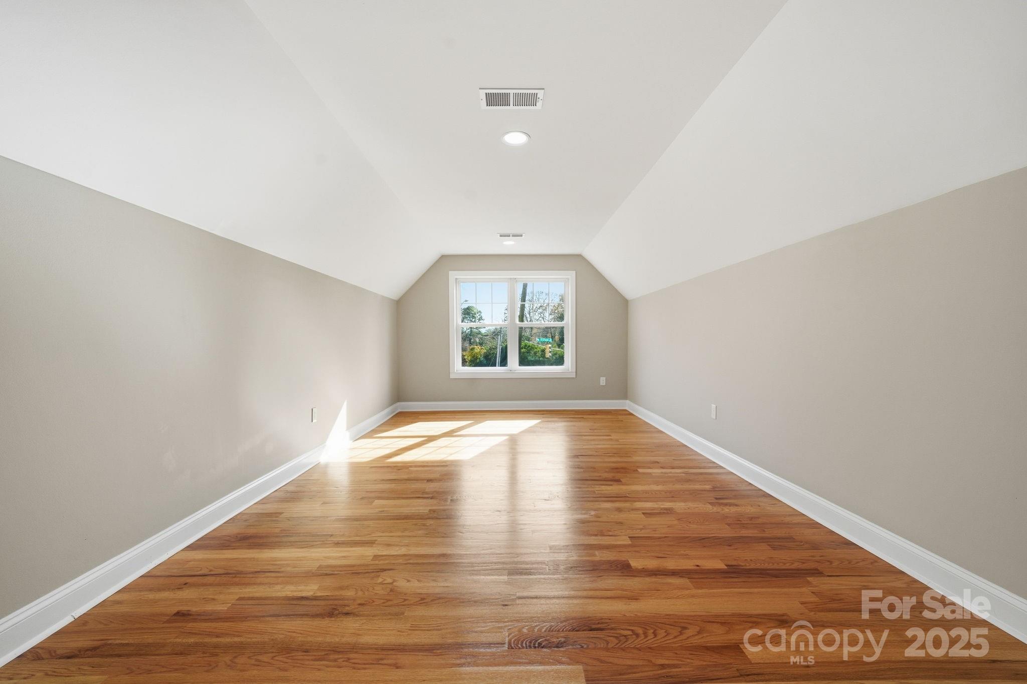 101 McAlway Road Charlotte, NC 28211 - Photo 15 of 40 an empty room with wooden floor and windows