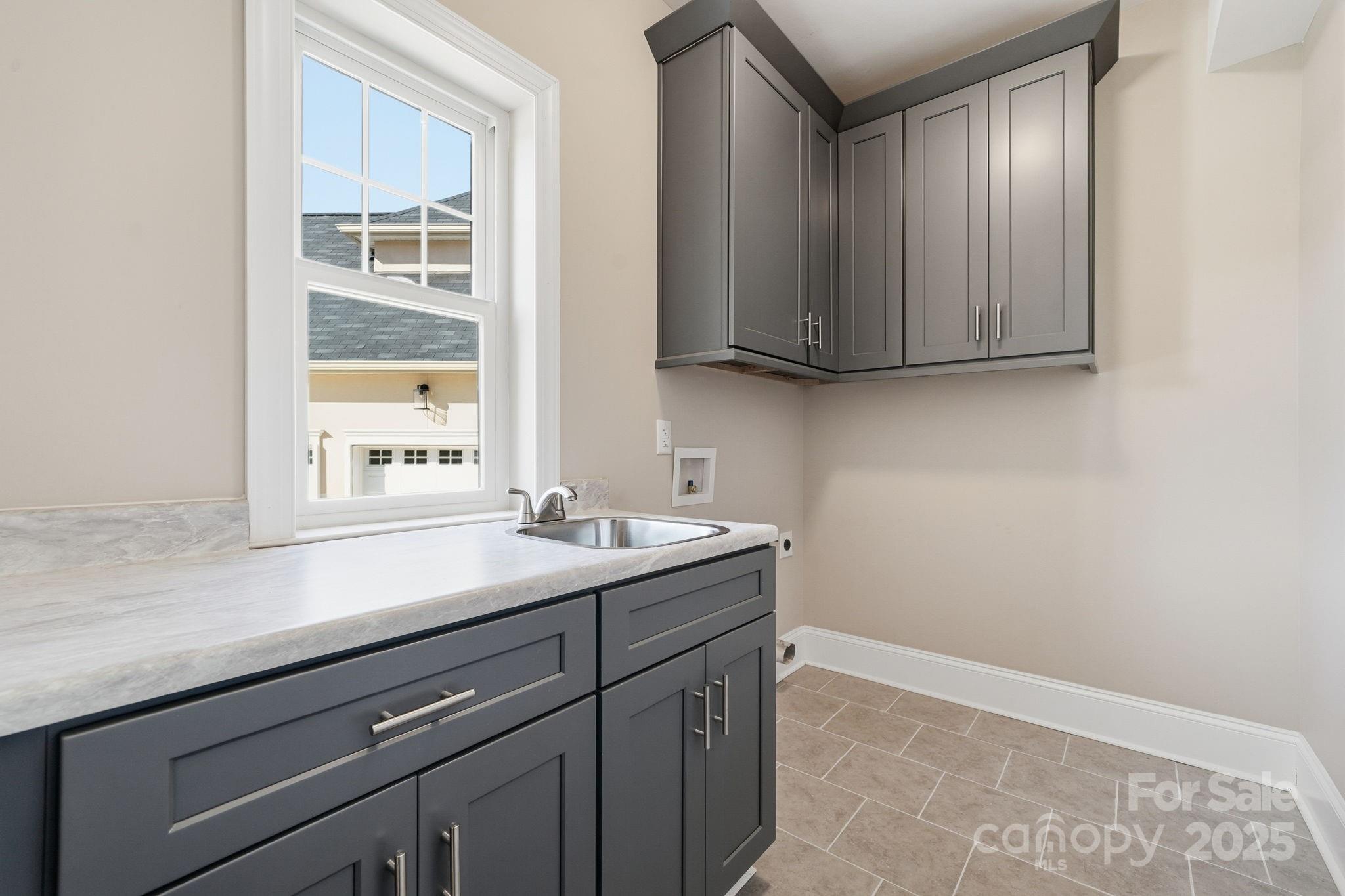 101 McAlway Road Charlotte, NC 28211 - Photo 6 of 40 a room with a sink cabinets and a window