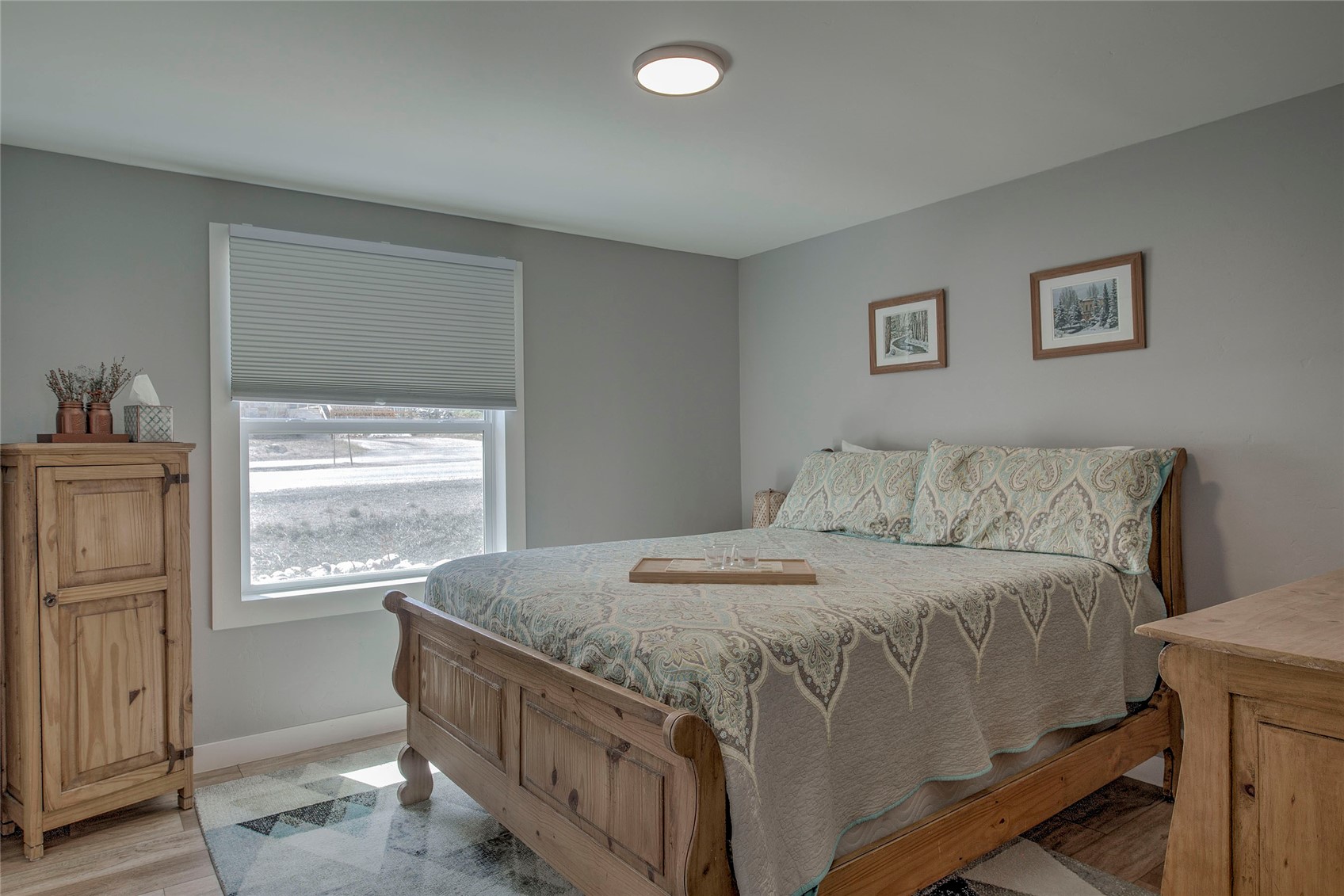 472 Ryan Gulch Road Silverthorne, CO 80498 - Photo 11 of 36 a bedroom with a bed and a window