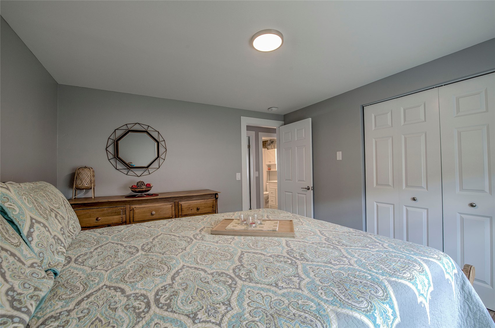 472 Ryan Gulch Road Silverthorne, CO 80498 - Photo 12 of 36 a bed room with a bed and a dresser