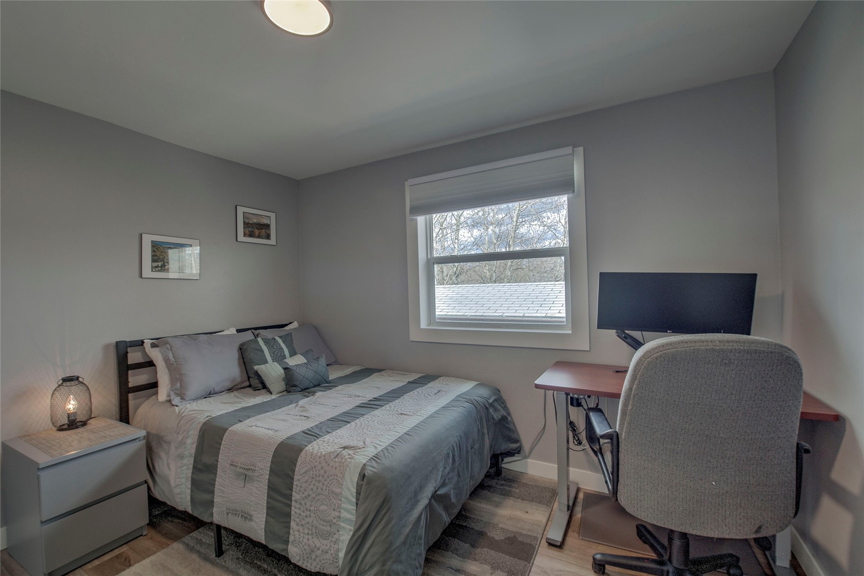 472 Ryan Gulch Road Silverthorne, CO 80498 - Photo 13 of 36 a bedroom with a bed a chair and a window