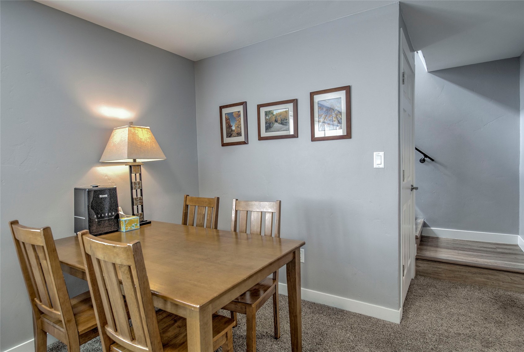 472 Ryan Gulch Road Silverthorne, CO 80498 - Photo 20 of 36 a view of a dining room with furniture and wooden floor