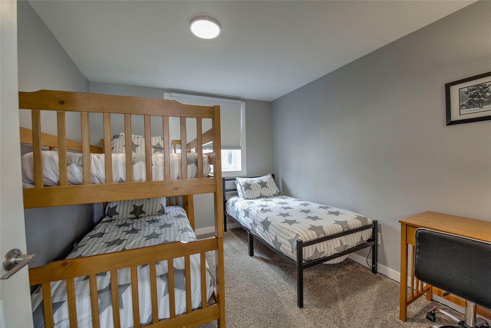 472 Ryan Gulch Road Silverthorne, CO 80498 - Photo 22 of 36 a bedroom with a bed and a window