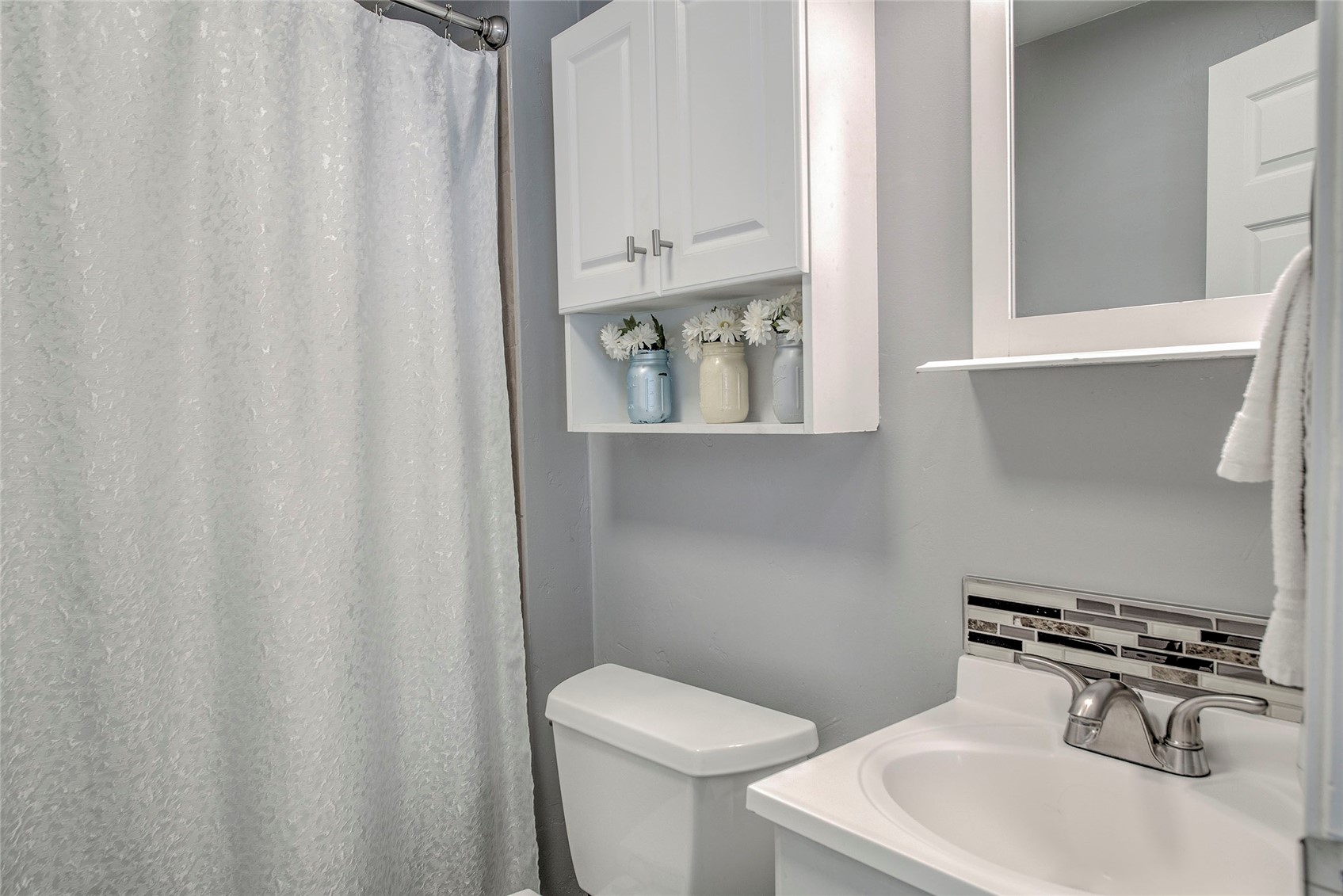 472 Ryan Gulch Road Silverthorne, CO 80498 - Photo 27 of 36 a bathroom with a sink a toilet and mirror