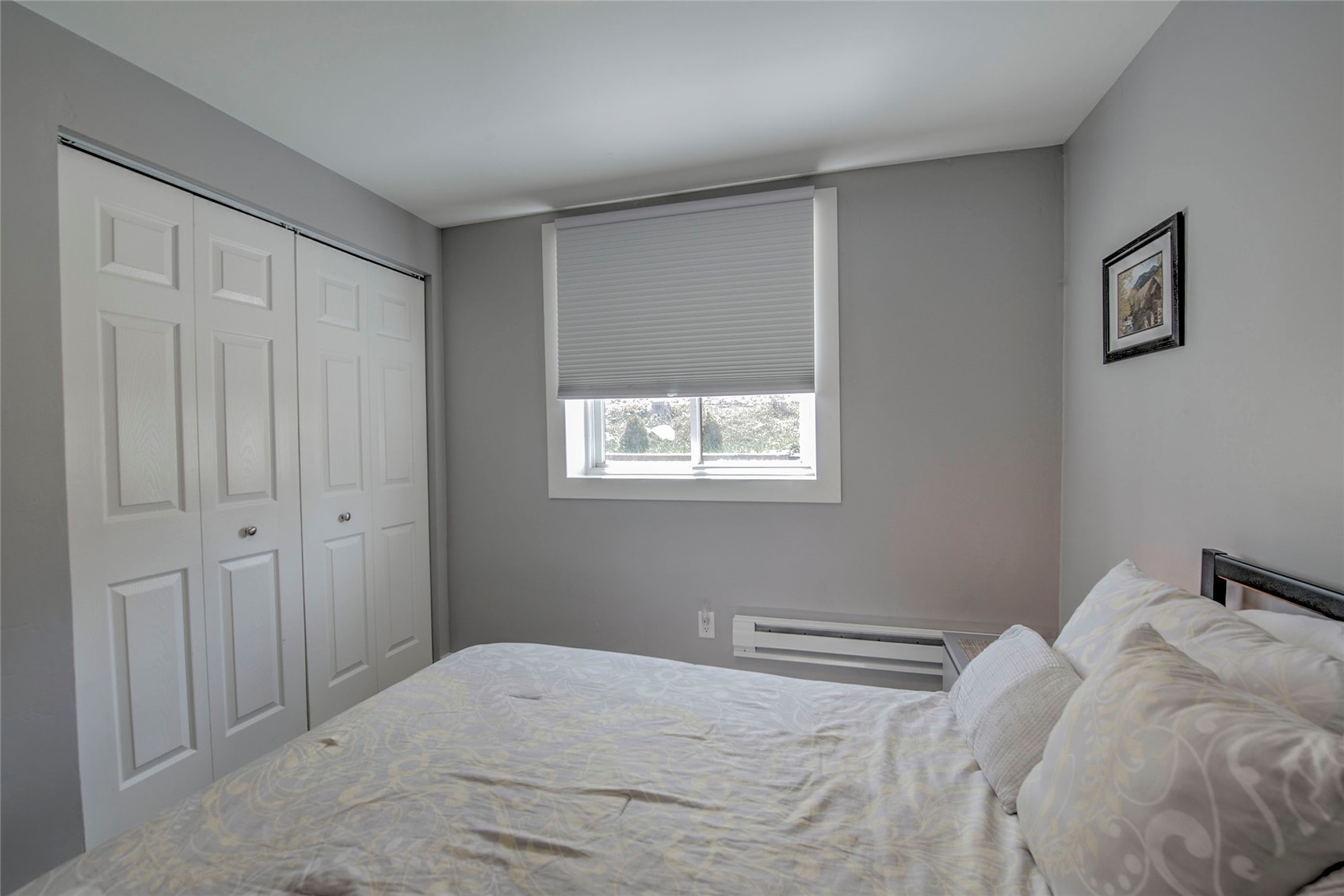 472 Ryan Gulch Road Silverthorne, CO 80498 - Photo 29 of 36 a bedroom with a bed and a window