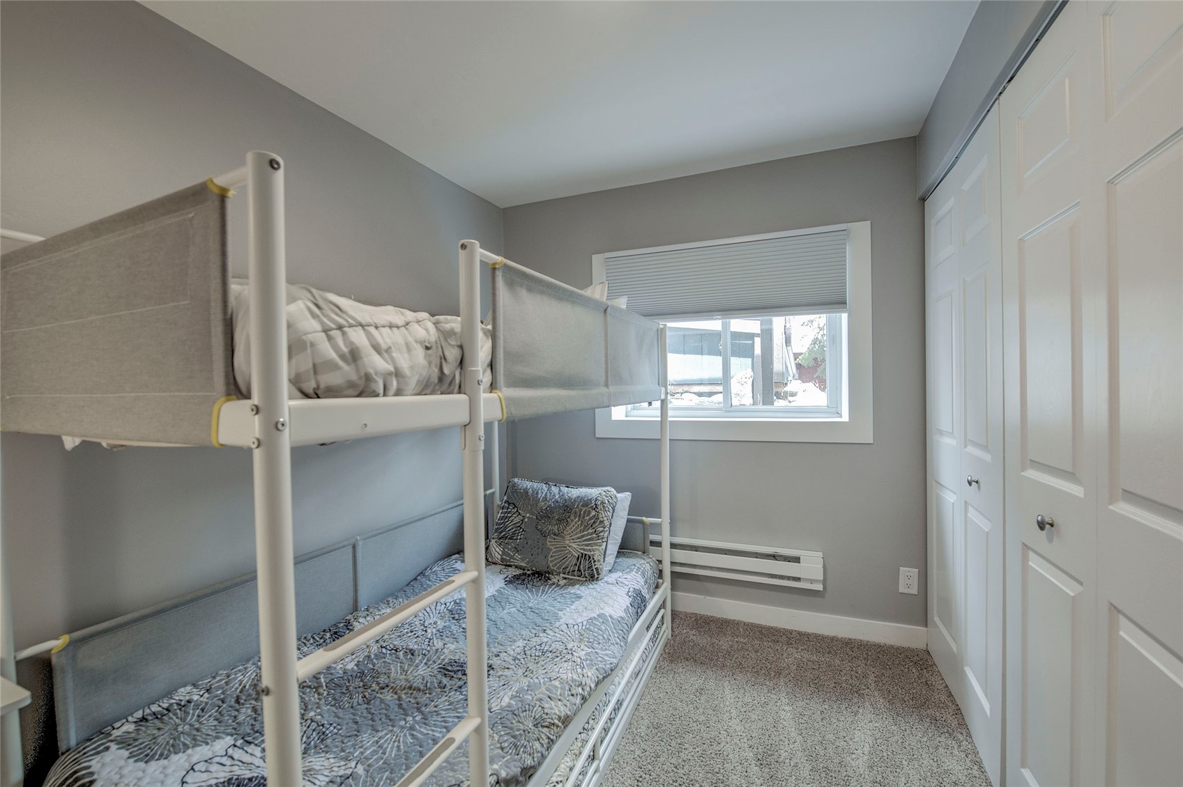 472 Ryan Gulch Road Silverthorne, CO 80498 - Photo 31 of 36 a bedroom with a bed and a window