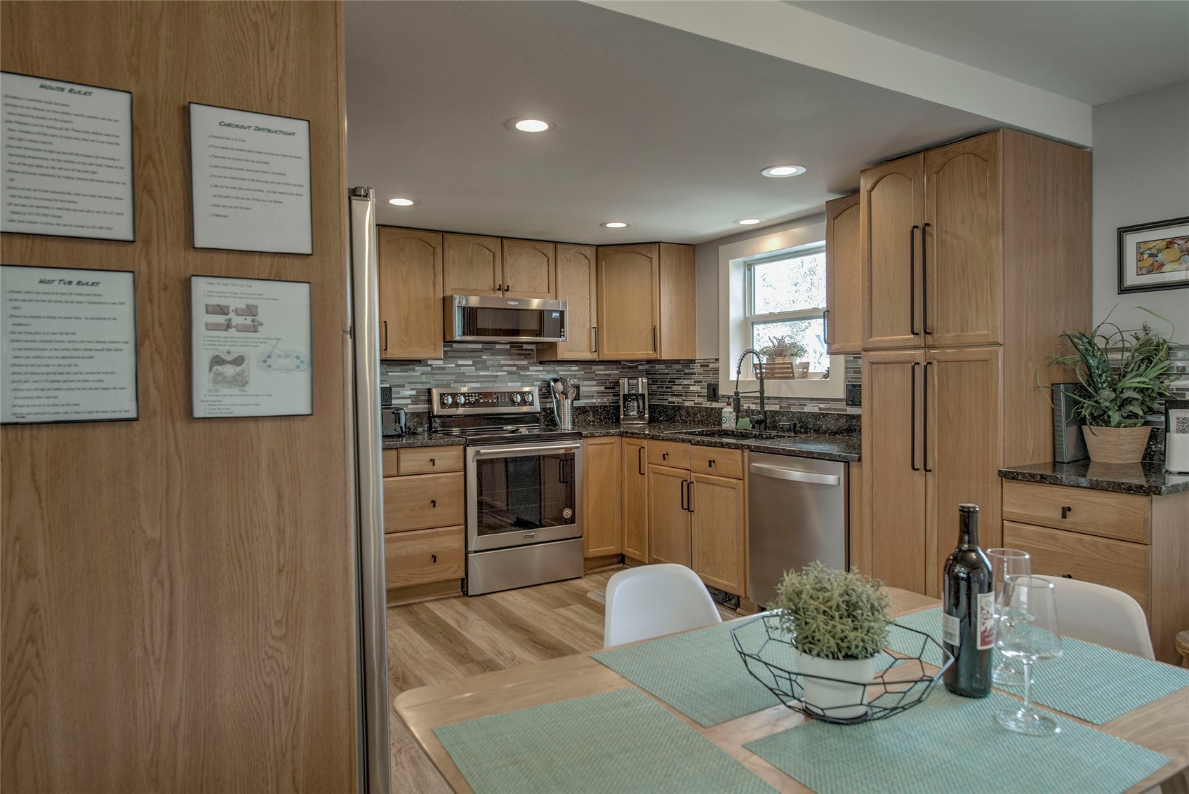 472 Ryan Gulch Road Silverthorne, CO 80498 - Photo 6 of 36 a kitchen with stainless steel appliances a stove a sink a microwave a refrigerator and cabinets