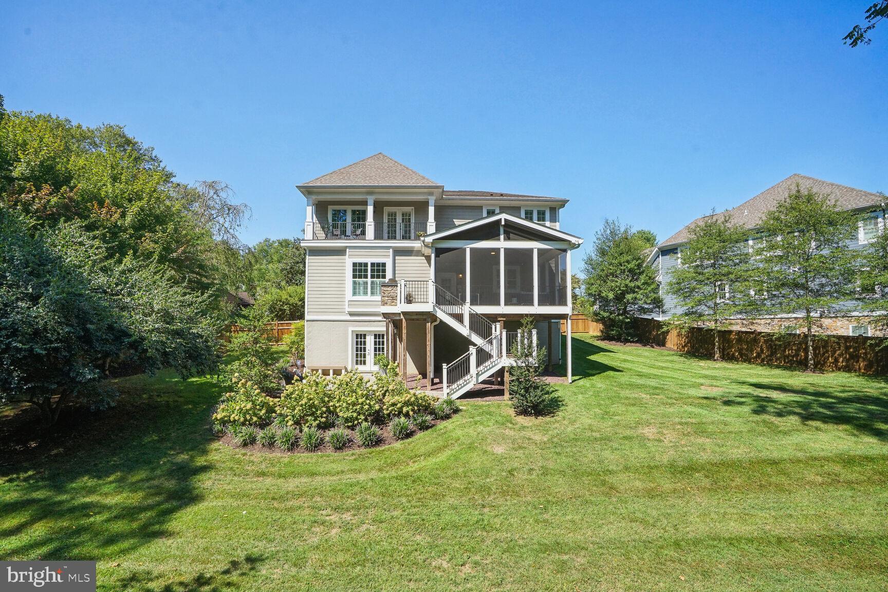 a view of a house with a yard patio and swimming pool