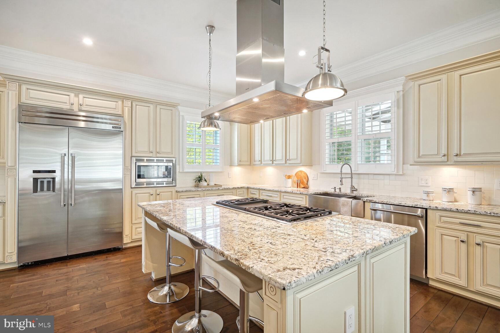 6701 Lumsden Street McLean, VA 22101 - Photo 11 of 57 a kitchen with a stove a refrigerator a sink and dishwasher with wooden floor