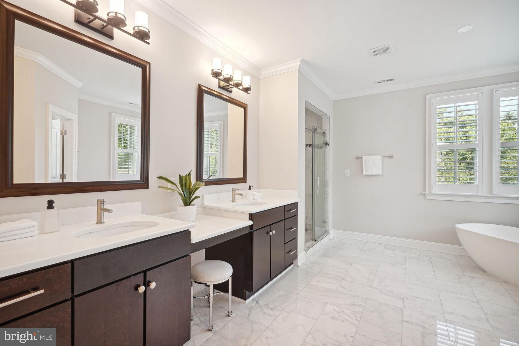 6701 Lumsden Street McLean, VA 22101 - Photo 24 of 57 a spacious bathroom with a double vanity sink mirror and a bathtub