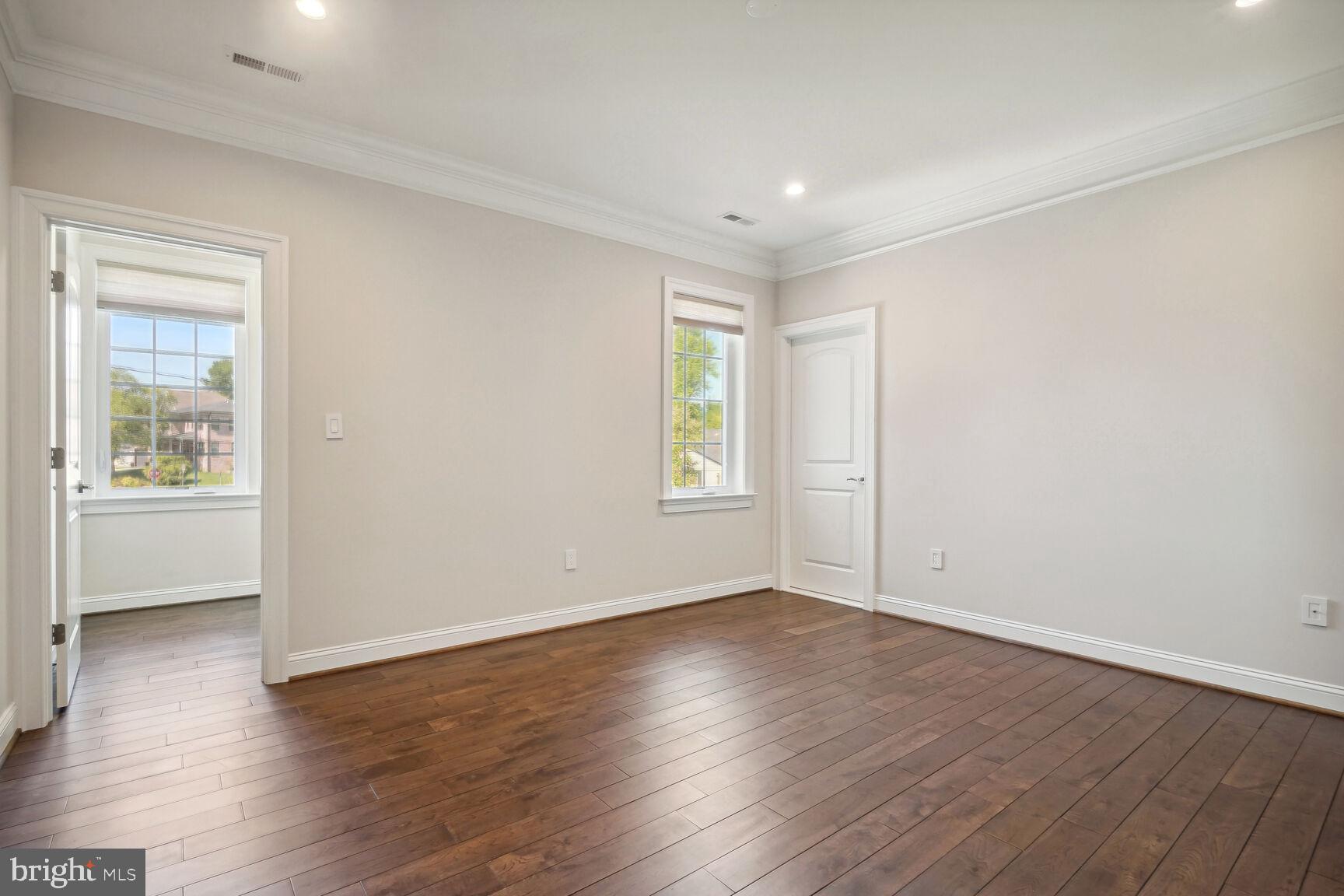 6701 Lumsden Street McLean, VA 22101 - Photo 31 of 57 a view of an empty room with wooden floor and a window