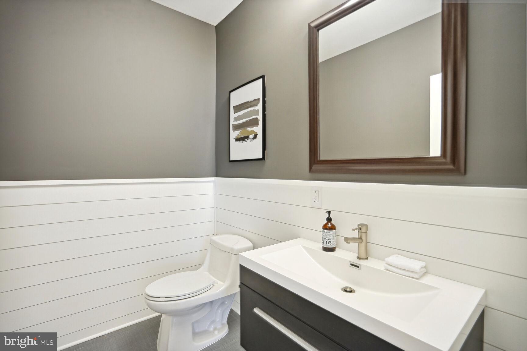 6701 Lumsden Street McLean, VA 22101 - Photo 42 of 57 a bathroom with a sink a toilet and mirror