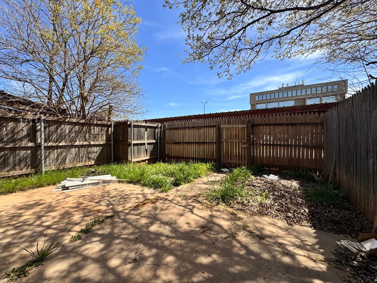 4707 48th Street Lubbock, TX 79414 - Photo 18 of 18 a backyard of a house with lots of green space