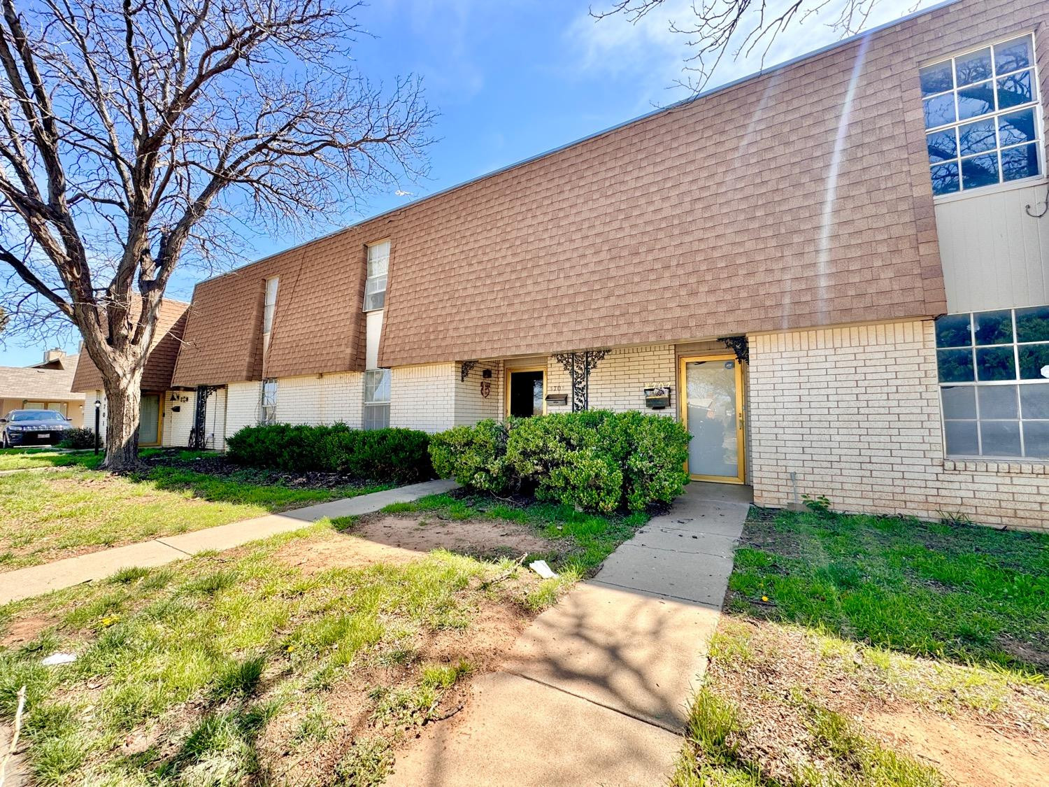 4707 48th Street Lubbock, TX 79414 - Photo 2 of 18 a front view of a house with garden