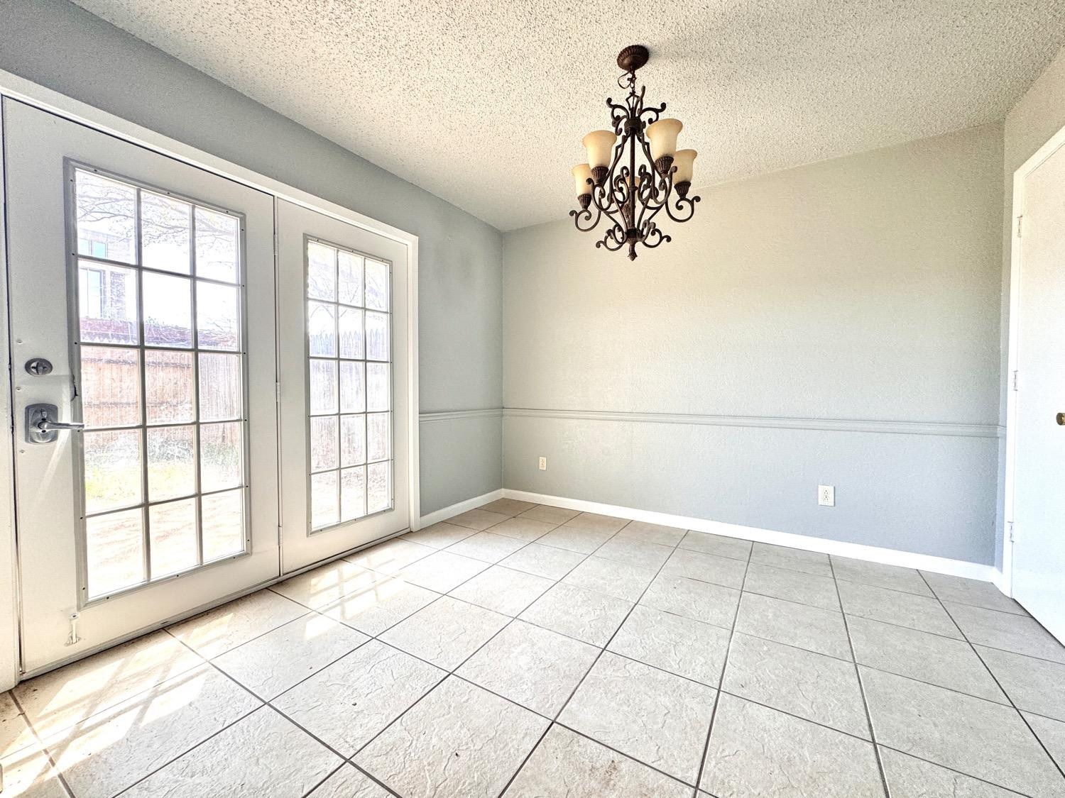 4707 48th Street Lubbock, TX 79414 - Photo 5 of 18 a view of an empty room with a window