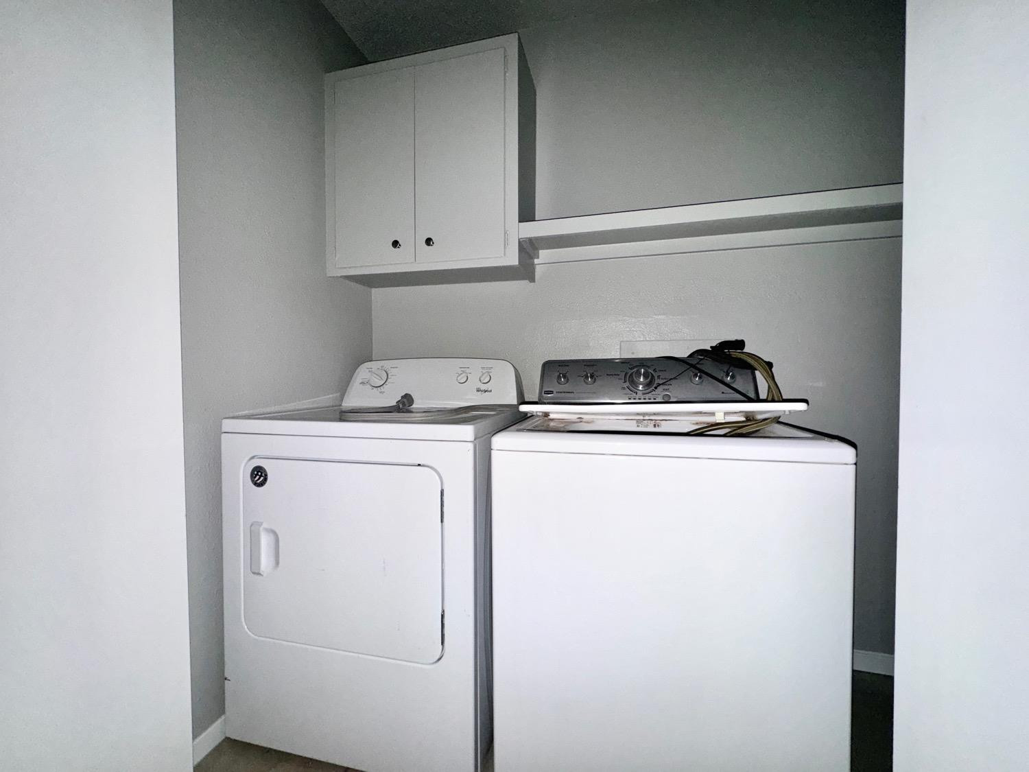 4707 48th Street Lubbock, TX 79414 - Photo 7 of 18 a utility room with dryer and washer