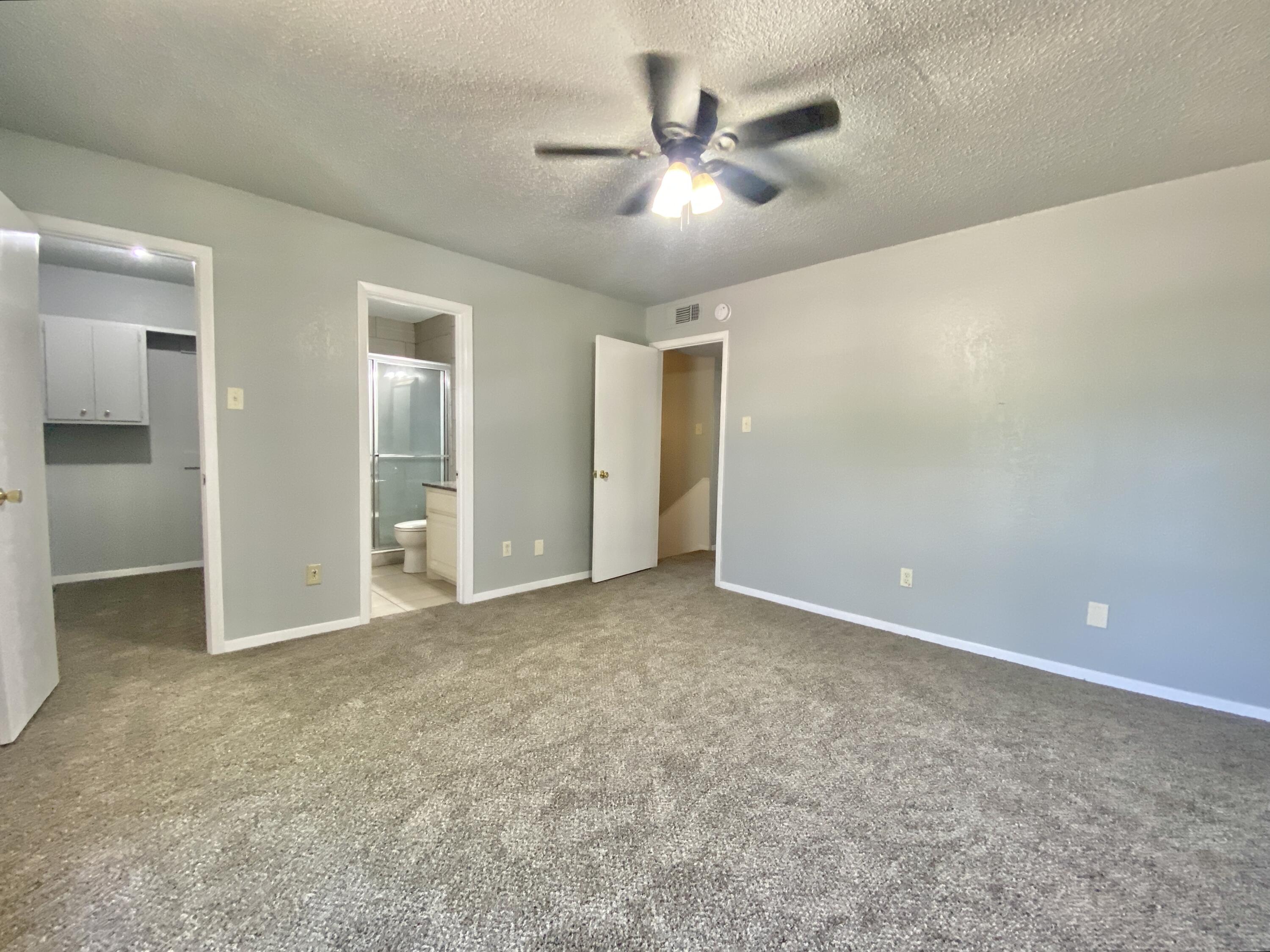 4707 48th Street Lubbock, TX 79414 - Photo 10 of 18 an empty room with closet and a ceiling fan