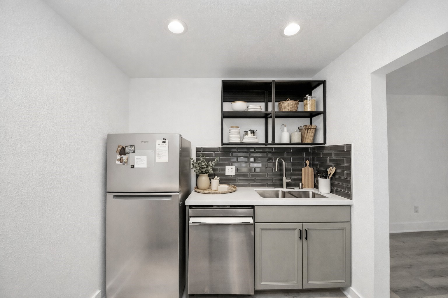 1014 Graham Drive Tomball, TX 77375 - Photo 11 of 37 a kitchen with stainless steel appliances granite countertop a refrigerator and a sink
