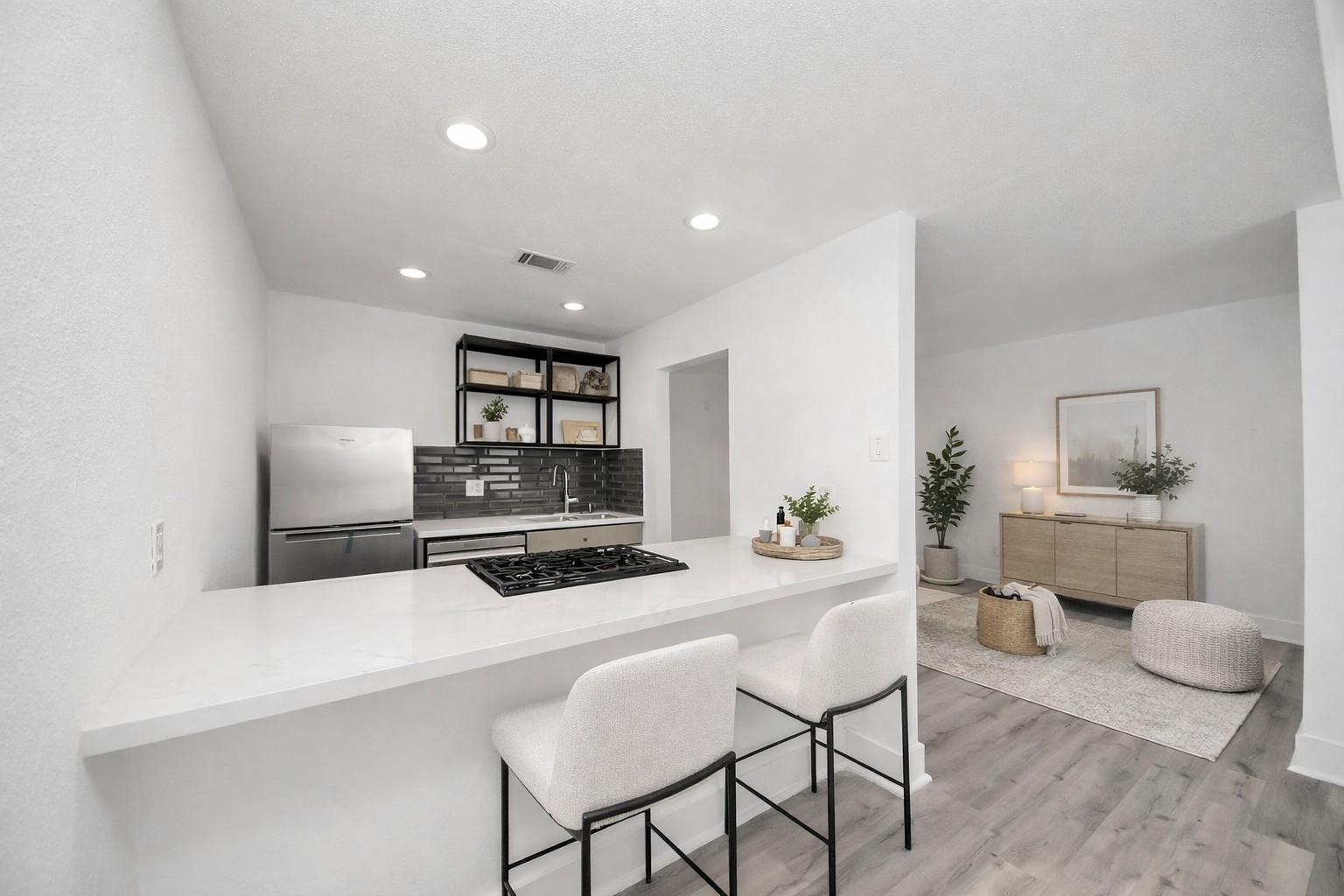 1014 Graham Drive Tomball, TX 77375 - Photo 16 of 37 a kitchen with a refrigerator a stove top oven a dining table and chairs with wooden floor
