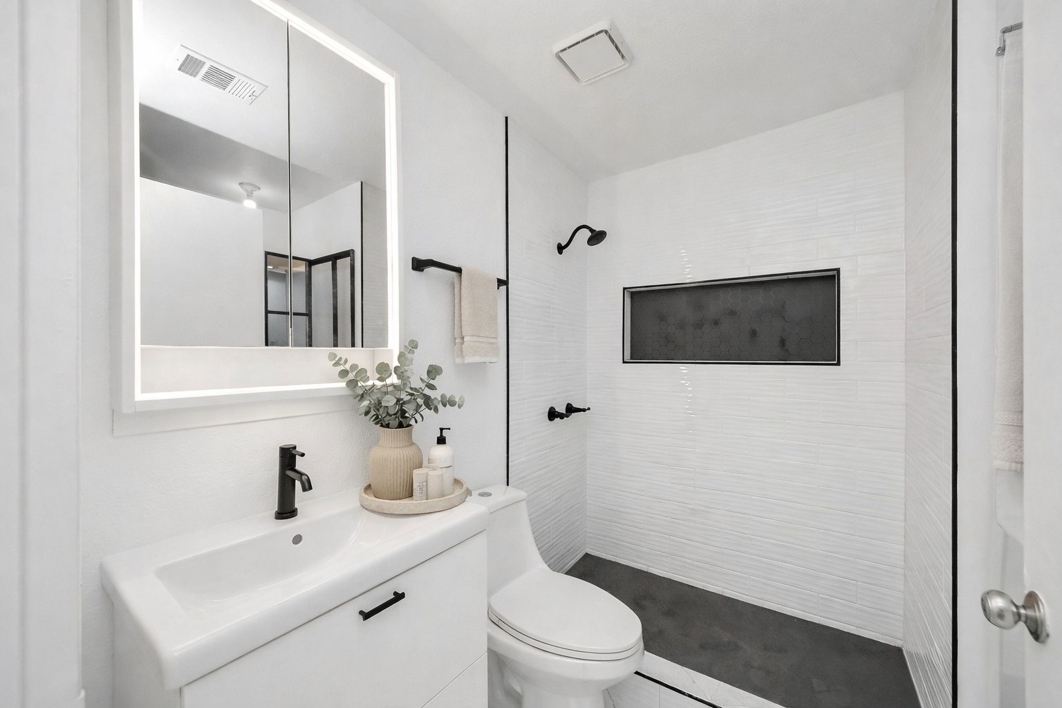 1014 Graham Drive Tomball, TX 77375 - Photo 17 of 37 a bathroom with a toilet a sink and a mirror