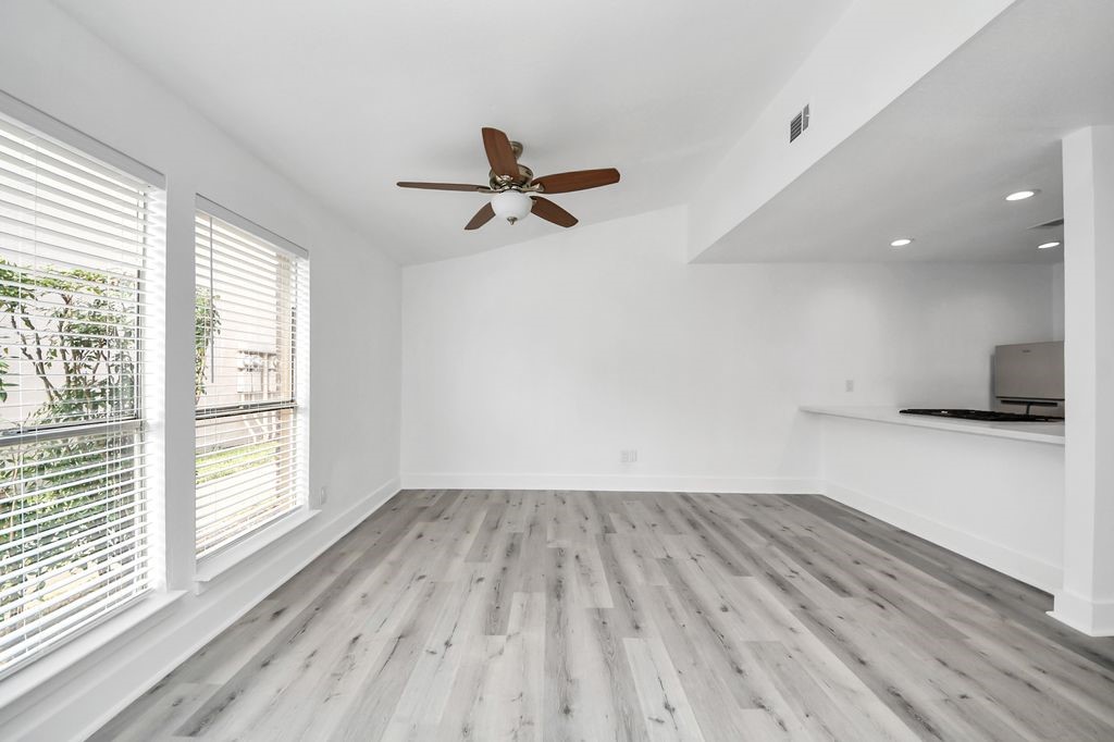 1014 Graham Drive Tomball, TX 77375 - Photo 2 of 37 wooden floor in an empty room with a window