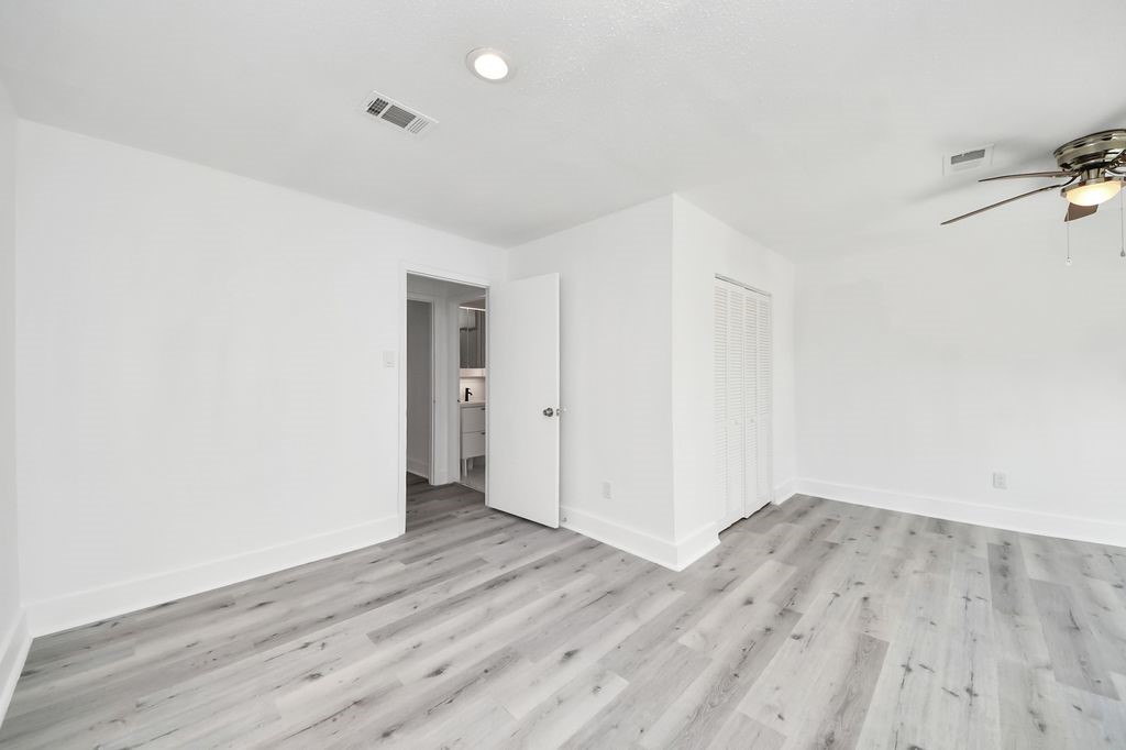 1014 Graham Drive Tomball, TX 77375 - Photo 27 of 37 a view of a room with wooden floor