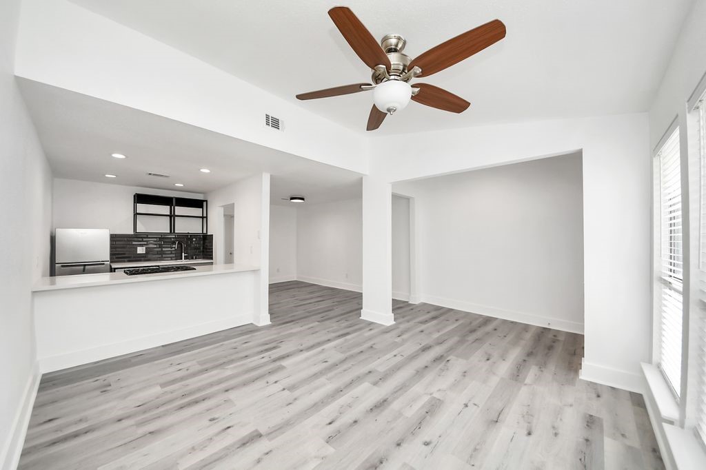 1014 Graham Drive Tomball, TX 77375 - Photo 3 of 37 a view of a kitchen with a sink and a stove top oven