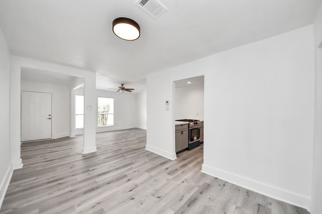 1014 Graham Drive Tomball, TX 77375 - Photo 8 of 37 a view of empty room with wooden floor