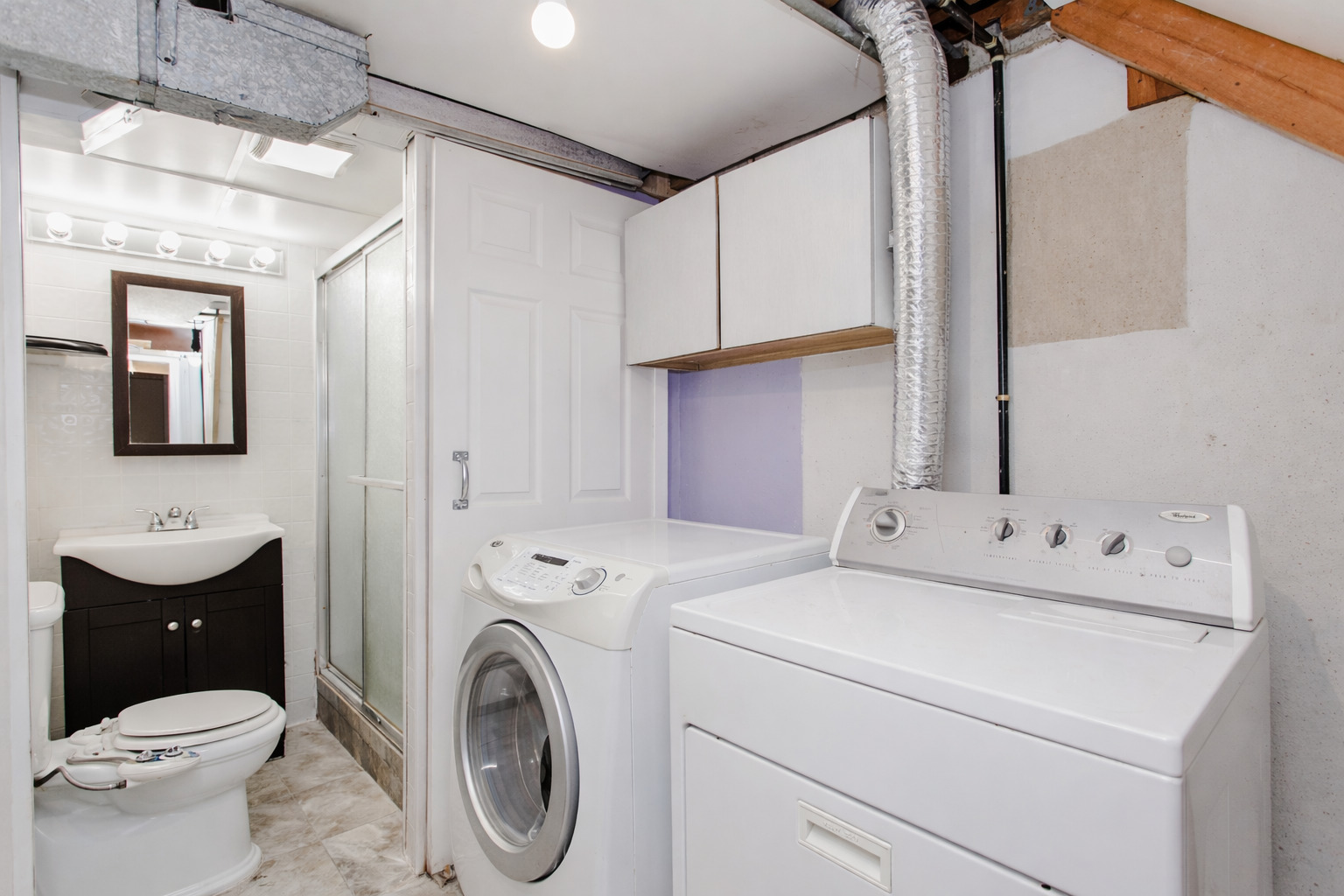 612 Maple Court, Unit 612 Mount Prospect, IL 60056 - Photo 12 of 12 a view of bathroom with a washer and dryer