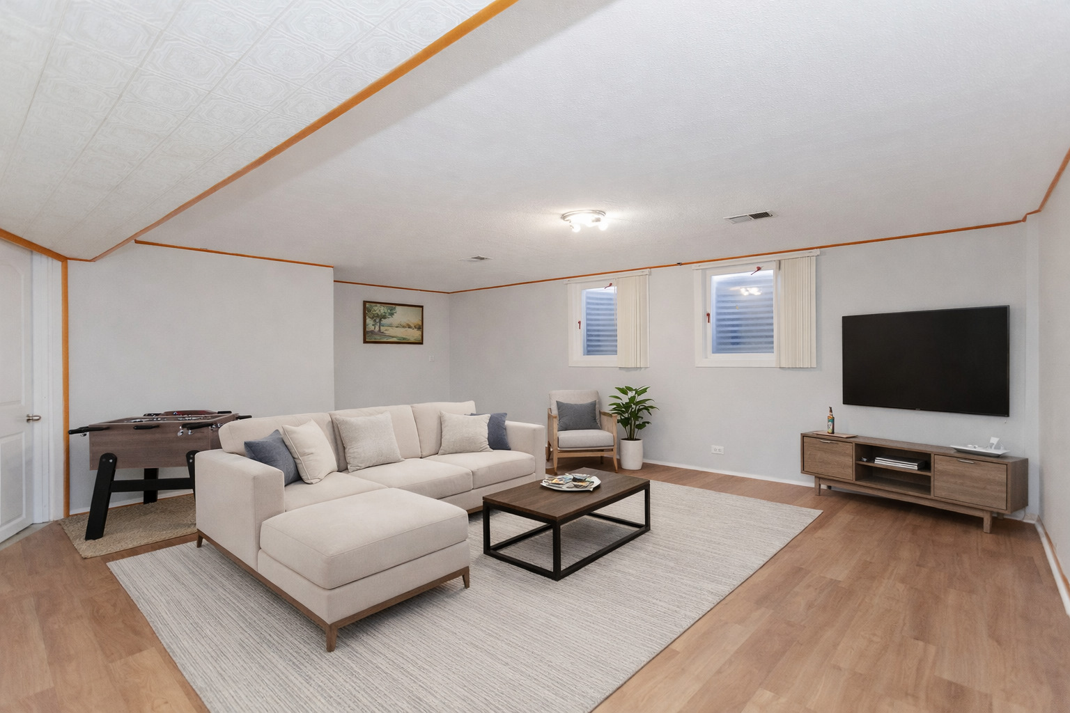 612 Maple Court, Unit 612 Mount Prospect, IL 60056 - Photo 9 of 12 a living room with furniture and a flat screen tv