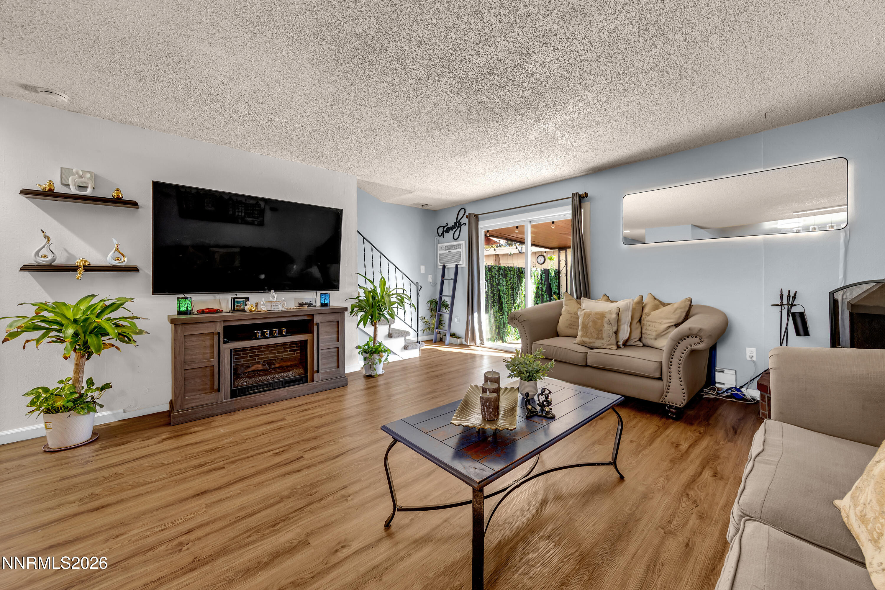 562 Smithridge Park Reno, NV 89502 - Photo 15 of 43 a living room with furniture and a flat screen tv