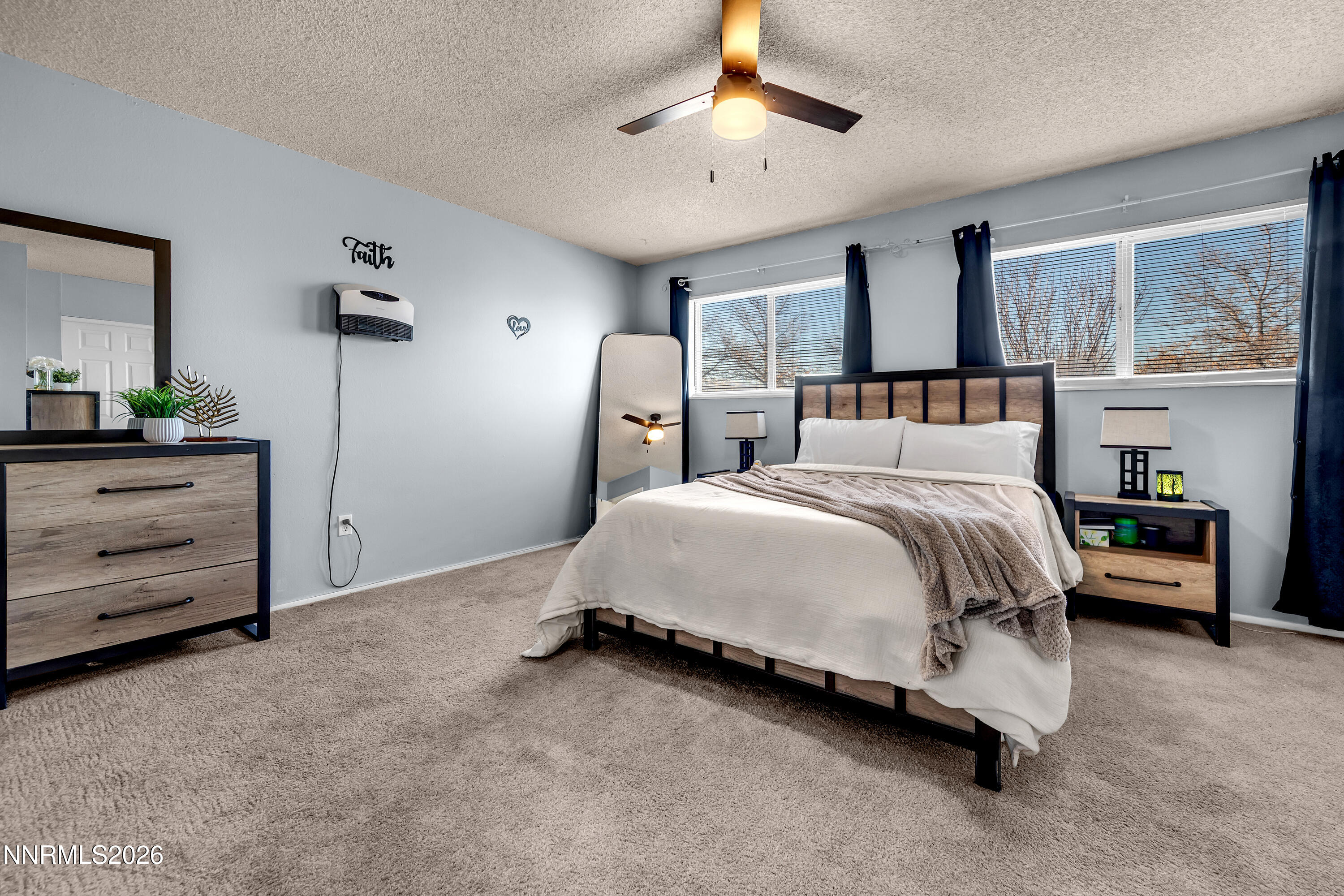 562 Smithridge Park Reno, NV 89502 - Photo 22 of 43 a spacious bedroom with a bed and a dresser