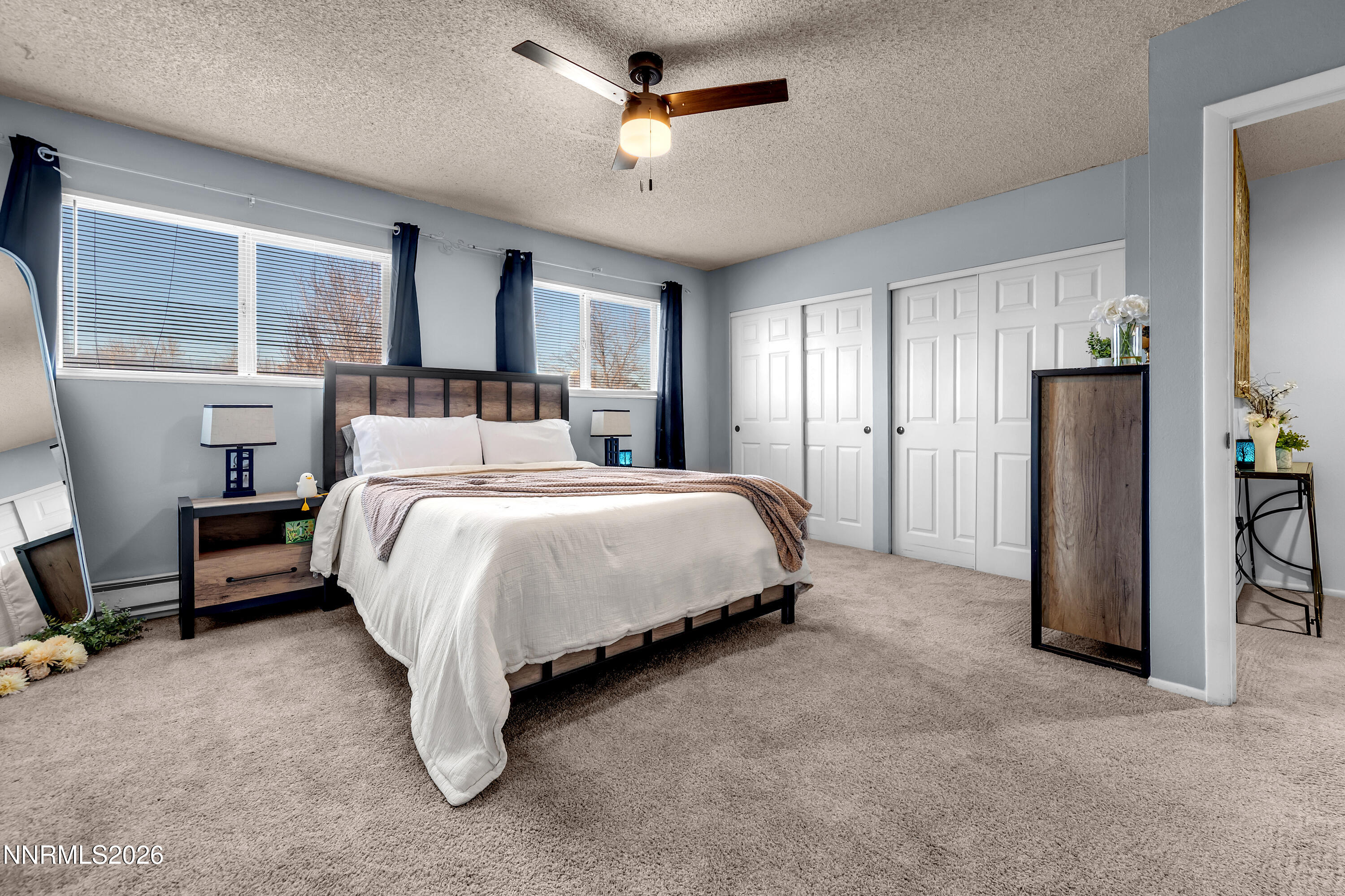 562 Smithridge Park Reno, NV 89502 - Photo 23 of 43 a bed room with a bed and a chandelier