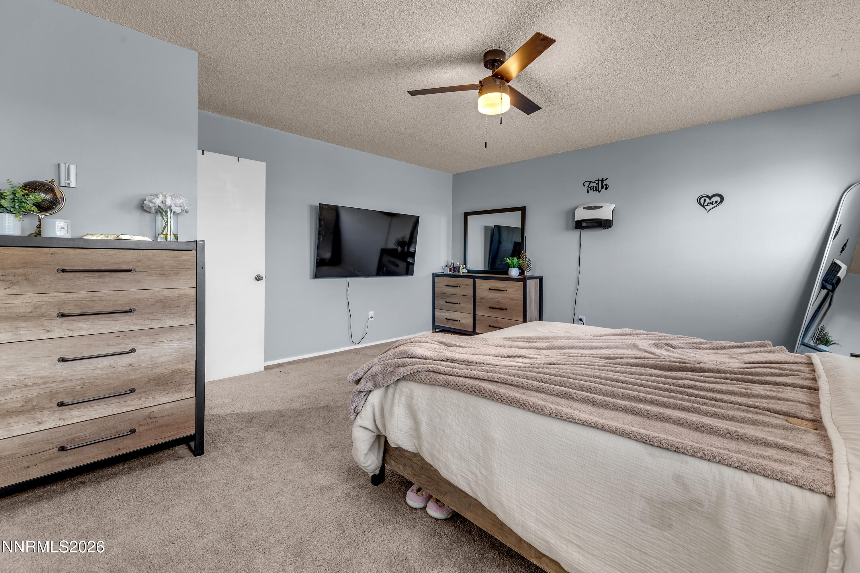 562 Smithridge Park Reno, NV 89502 - Photo 25 of 43 a bedroom with a bed and a flat screen tv