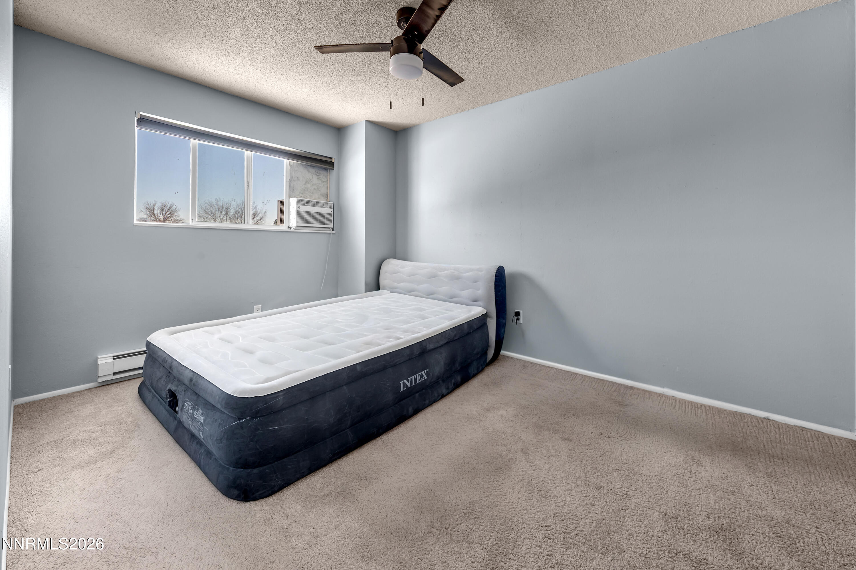 562 Smithridge Park Reno, NV 89502 - Photo 26 of 43 a room with a bed and a window