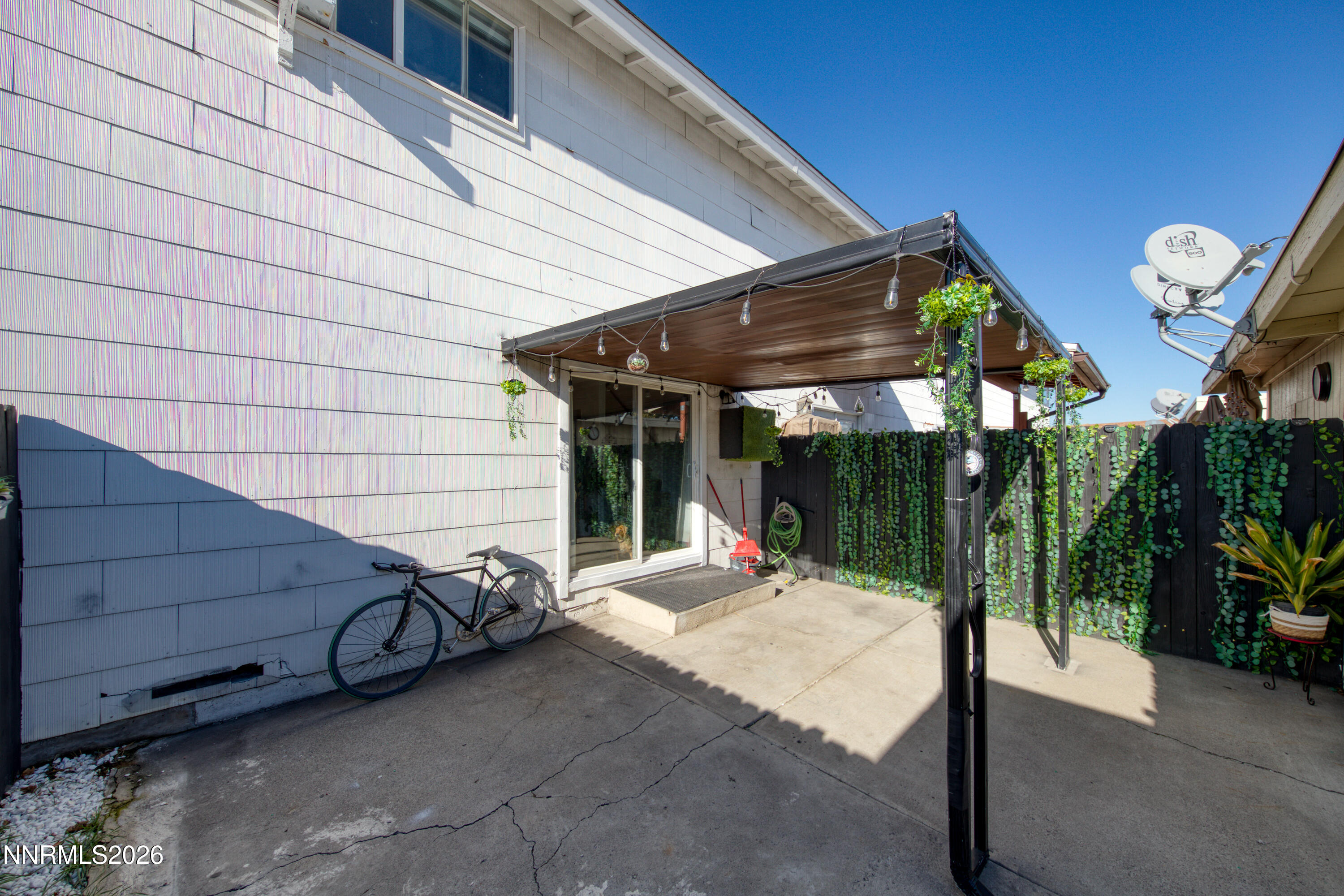 562 Smithridge Park Reno, NV 89502 - Photo 29 of 43 a view of a patio with a table and chairs under an umbrella